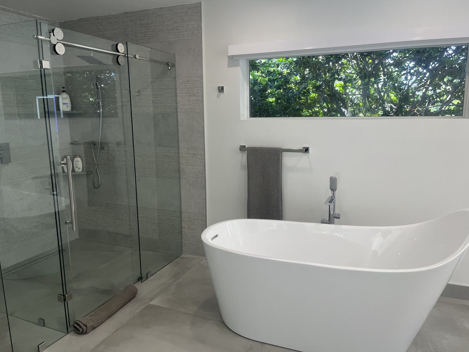 Bathroom with a freestanding tub after a move-out clean